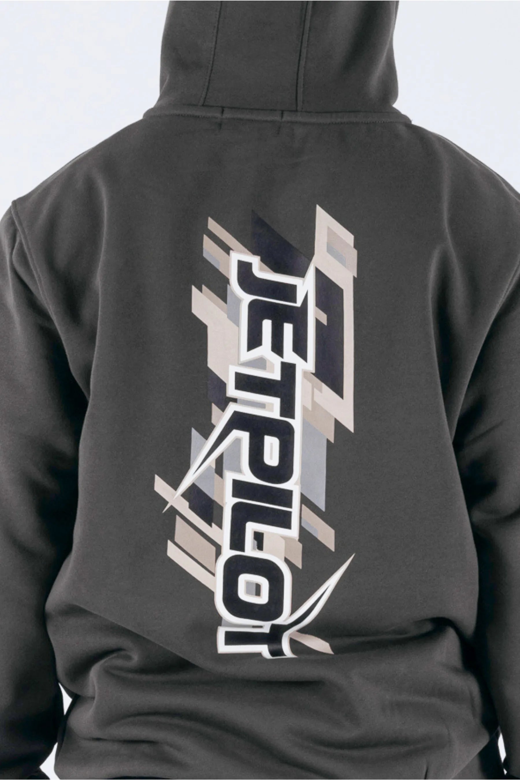 close up of a person wearing a charcoal pullover with a Jetpilot logo on a white background — view 4 (3)