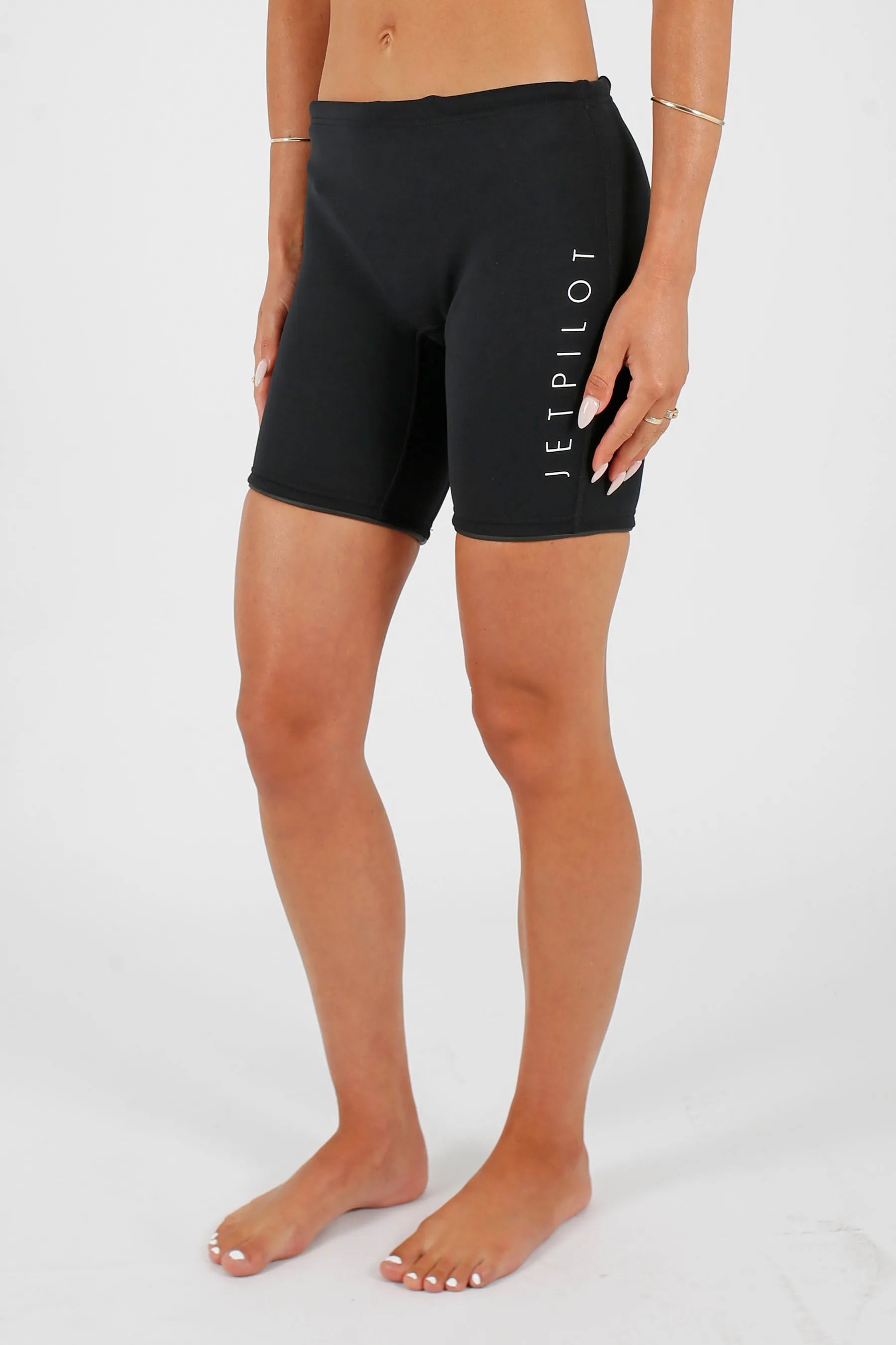 Person wearing Jetpilot Corp 7" Neoprene Short - Black with a brand logo on a white background — view 7 (3)
