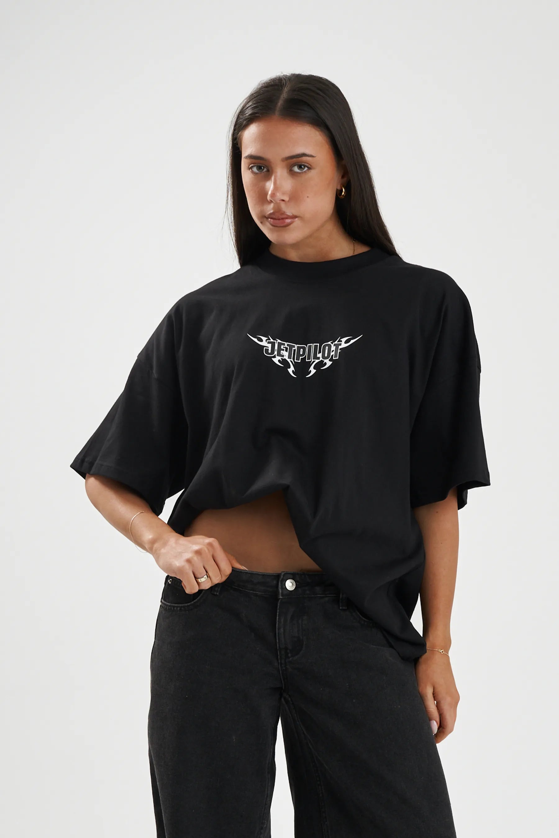 Jetpilot Company mens oversized graphic tee in Black — front view on a female model