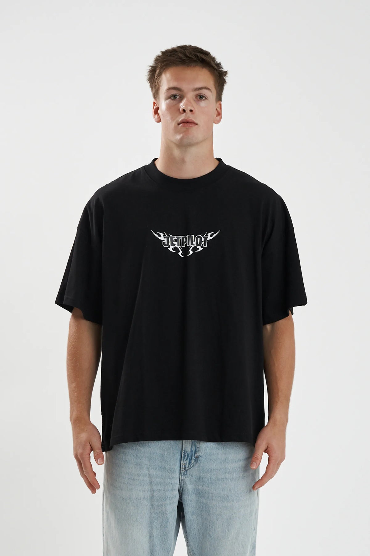 Jetpilot Company mens oversized graphic tee in Black — front view on a male model