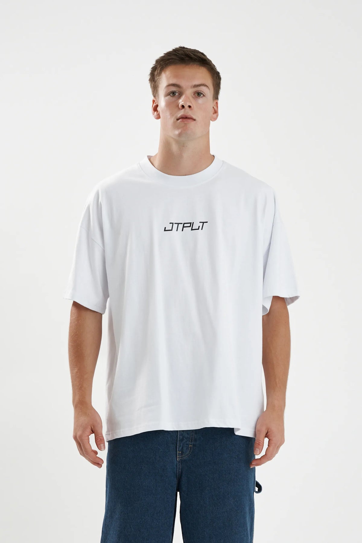 Jetpilot Vault Core mens oversized graphic tee in White — front view on a male model