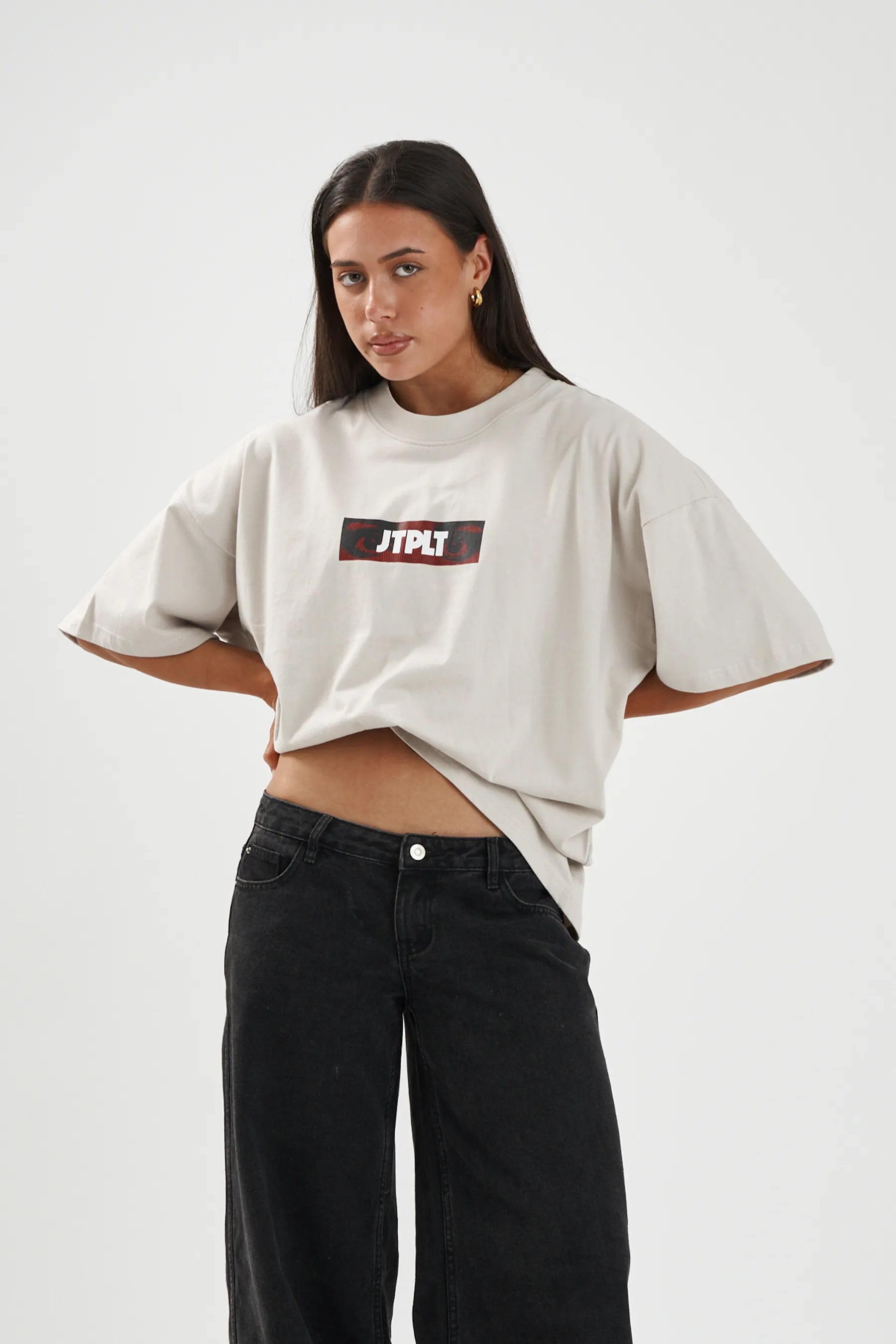Jetpilot Spiral mens oversized graphic tee in Sand — front view on a female model