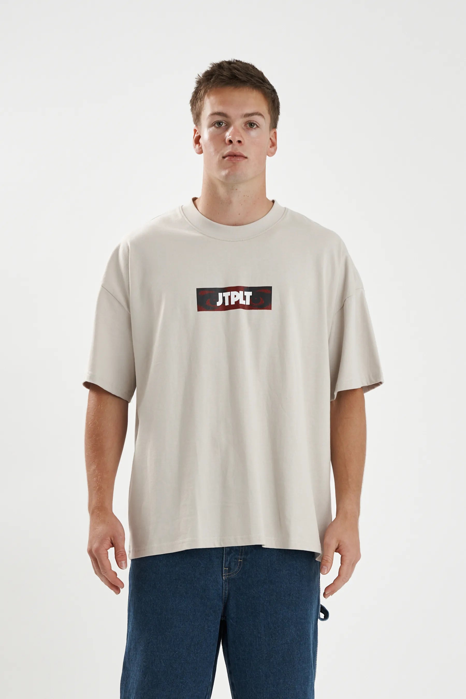 Jetpilot Spiral mens oversized graphic tee in Sand — front view on a male model