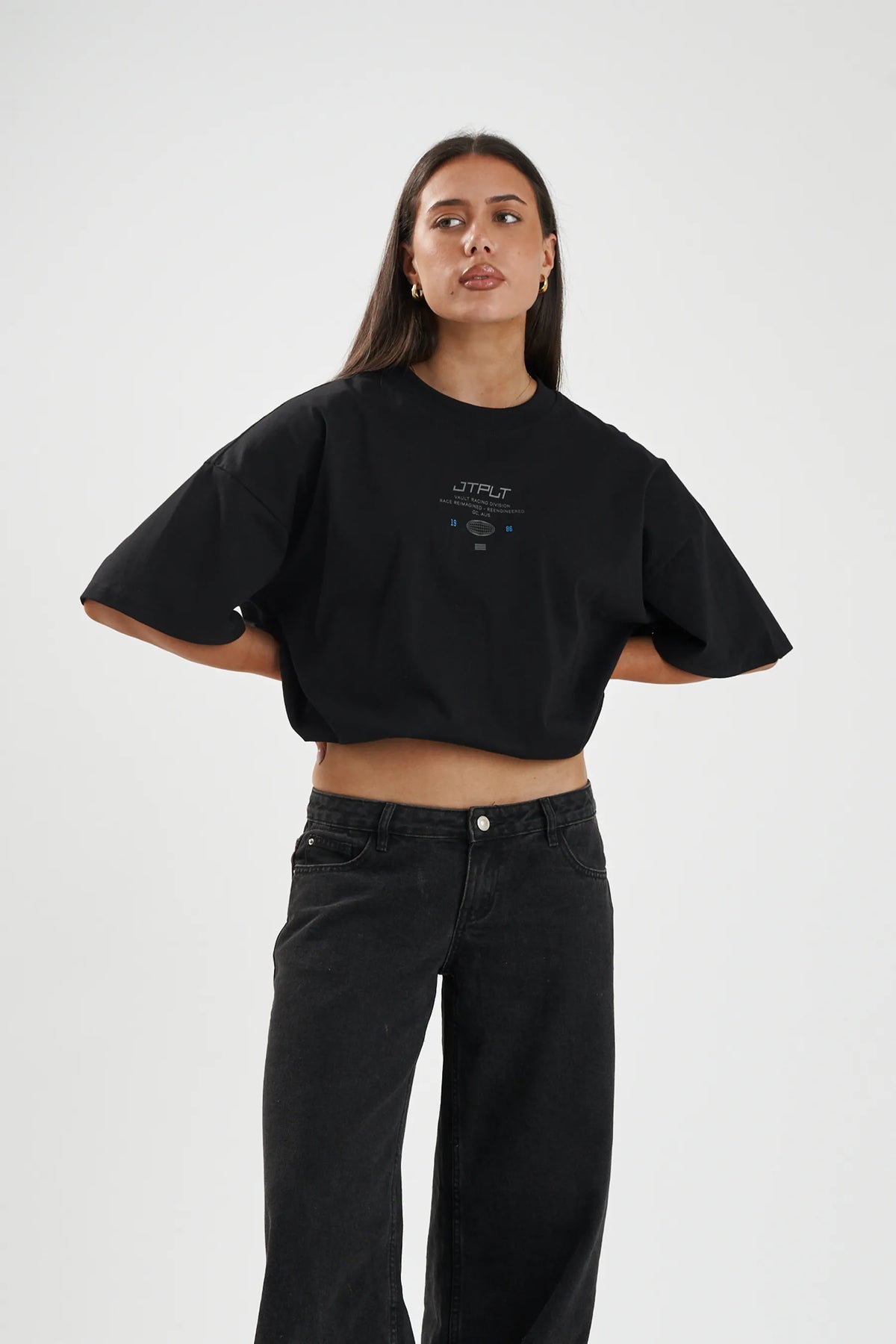 Jetpilot Vault Tech mens oversized graphic tee in Black — front view on a female model