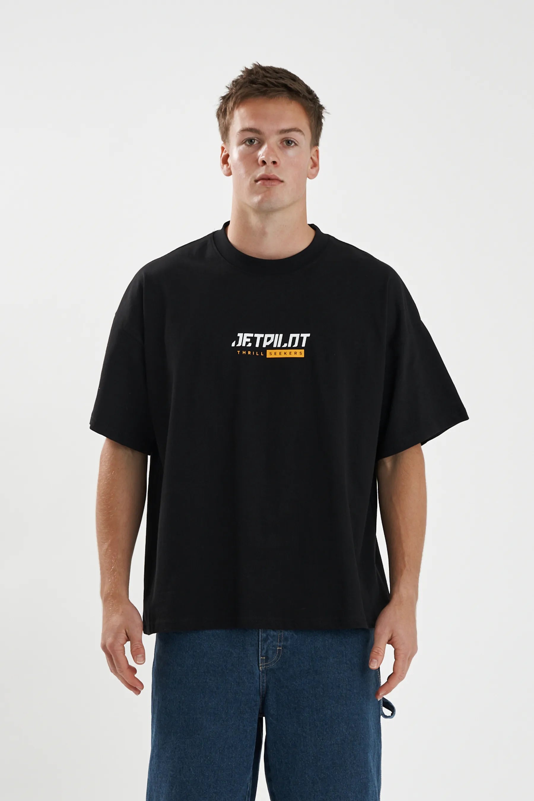 Jetpilot 86 Worldwide mens oversized graphic tee in Black — front view on a male model