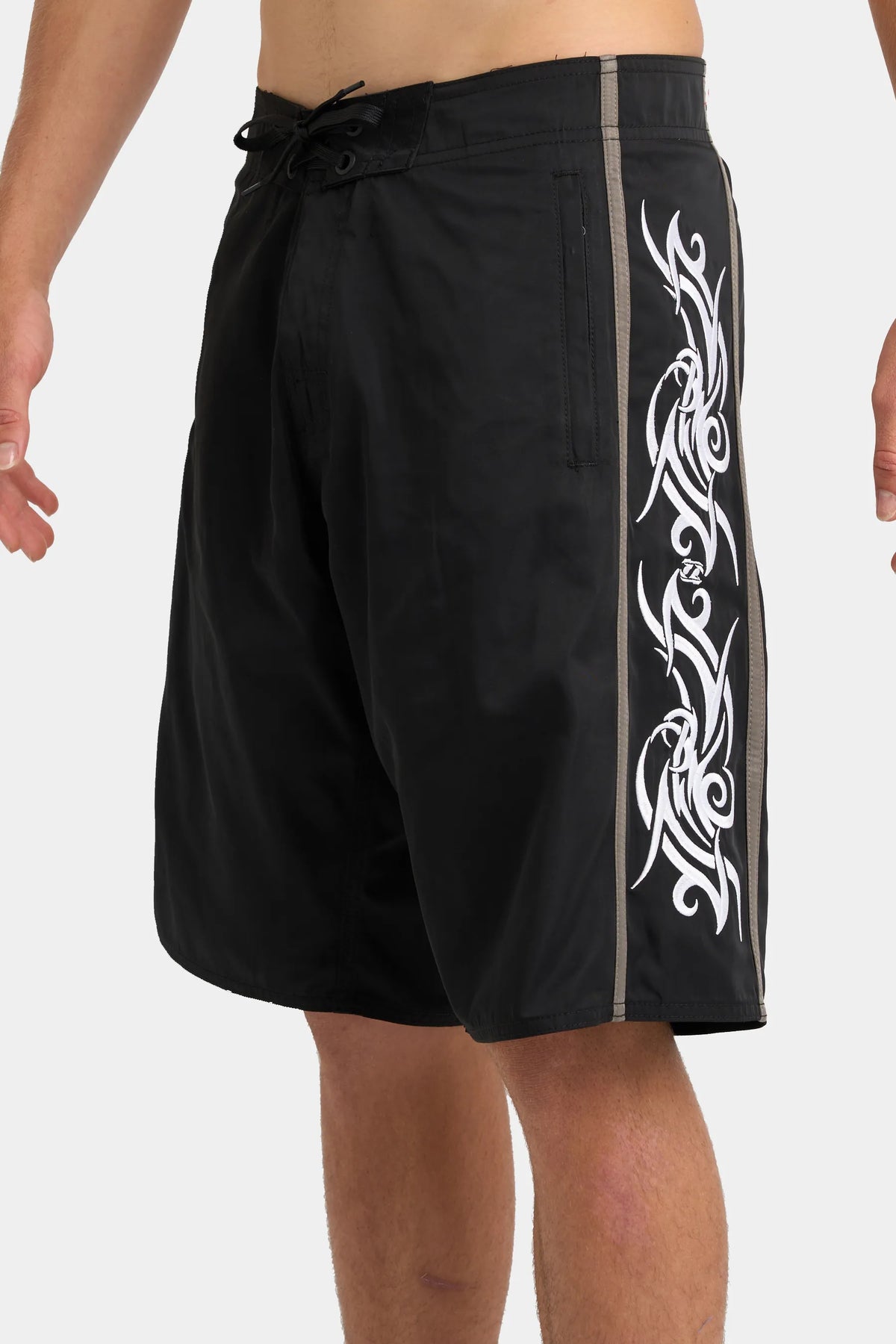 Jetpilot Tribalism mens board shorts in Black — side view, close-up