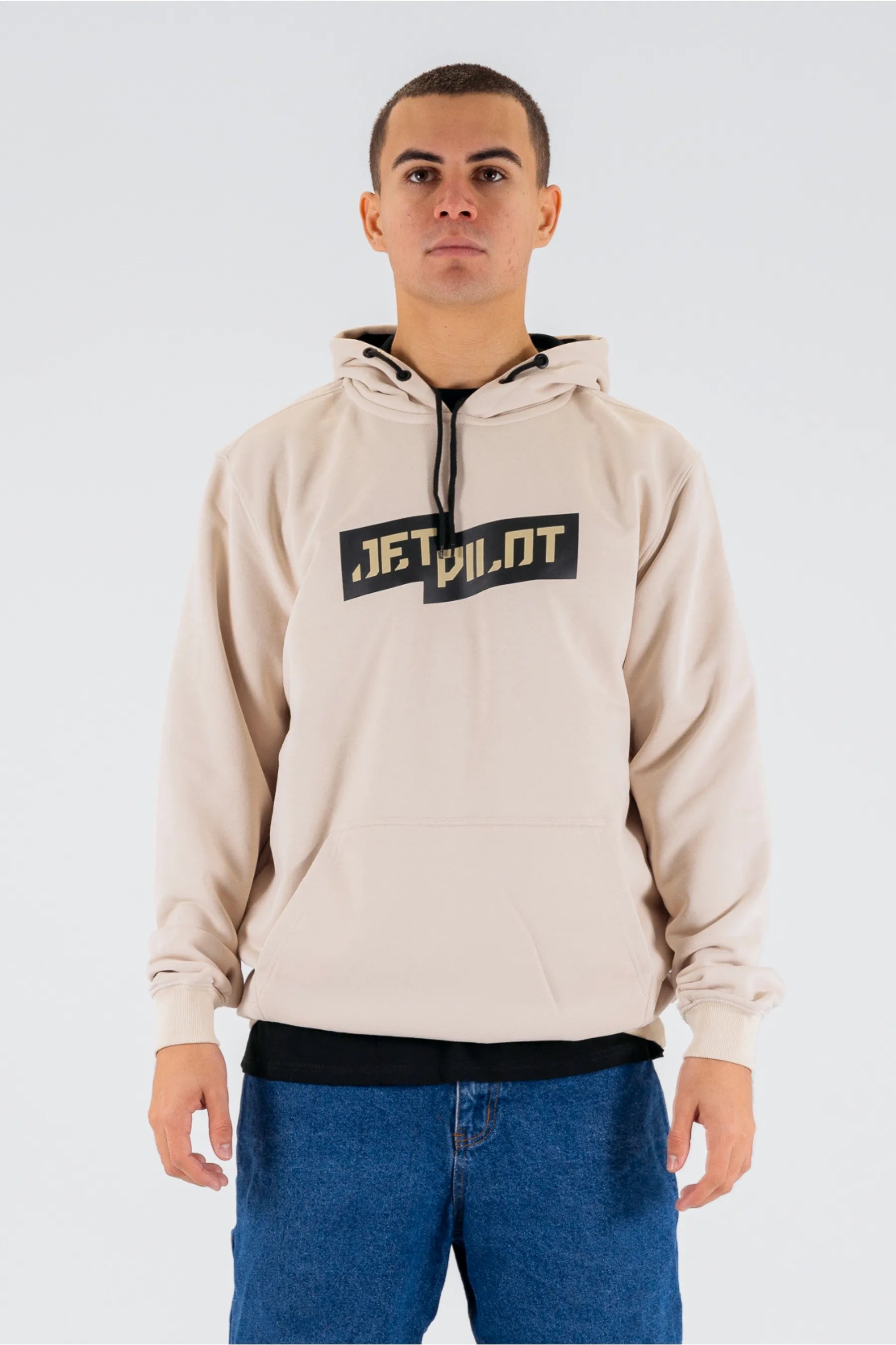 Front view of a person wearing a cement pullover with a Jetpilot logo on a white background — view 1 (3)