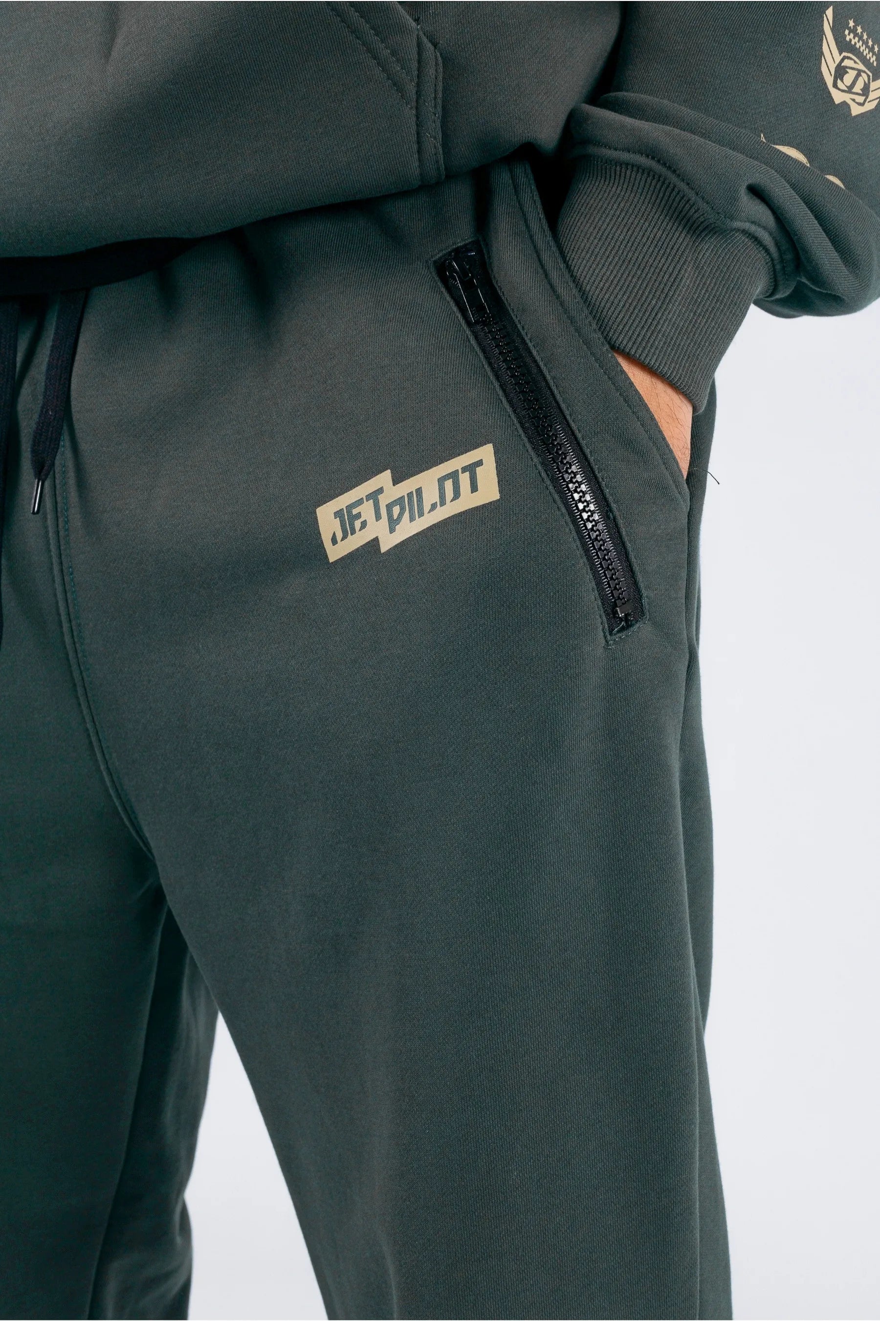 Close up of amazon green trackpants with Jetpilot logo — view 3 (3)