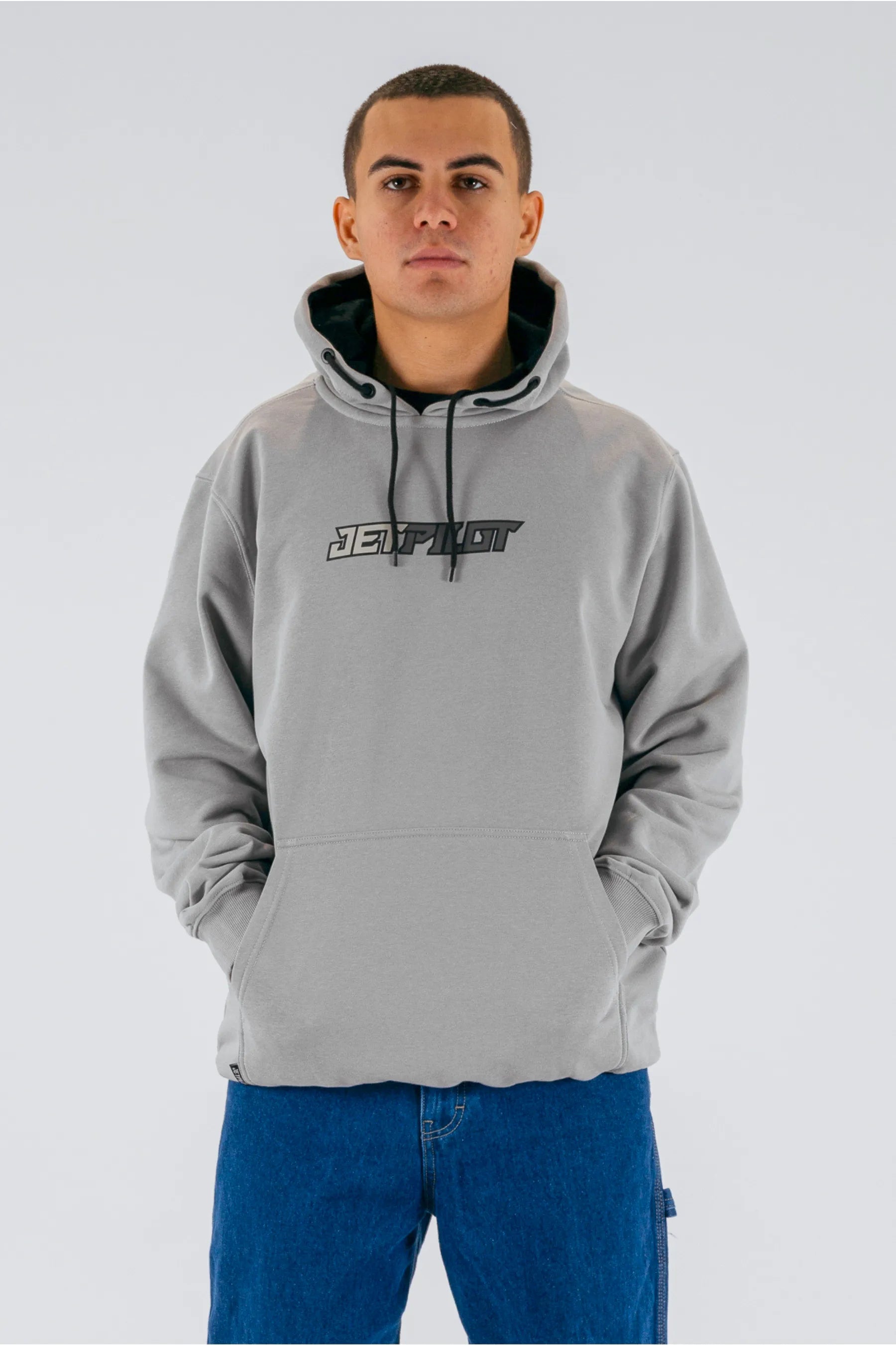 front view of a person wearing a grey pullover with a Jetpilot logo on a white background — view 1 (3)