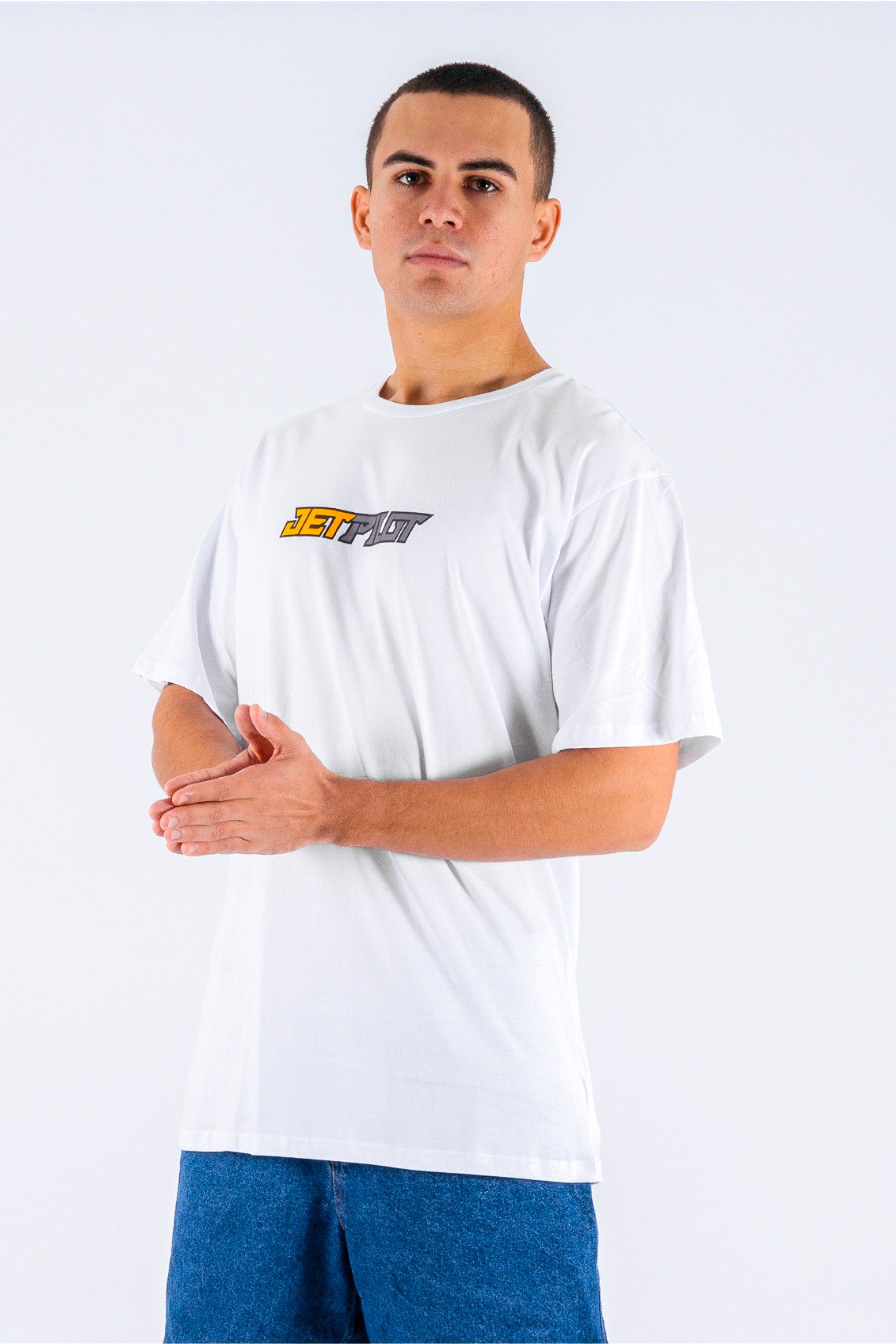 a person wearing a white tee with a Jetpilot logo on a white background — view 3 (5)