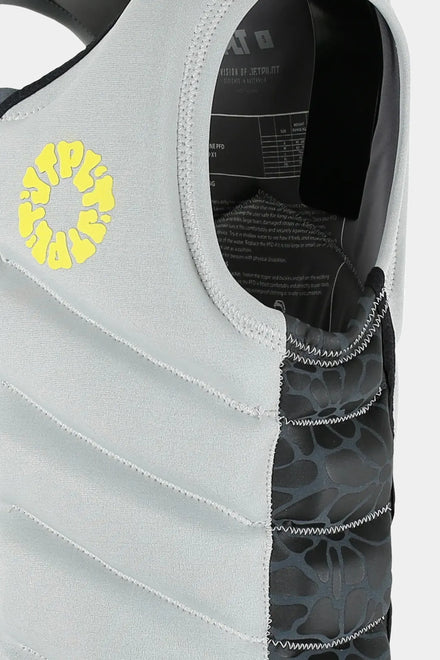 Close-up of a Jetpilot X1 Life Jacket - Busty Dunn Signature Series - Light Grey with a yellow floral JTPLT design on a white
