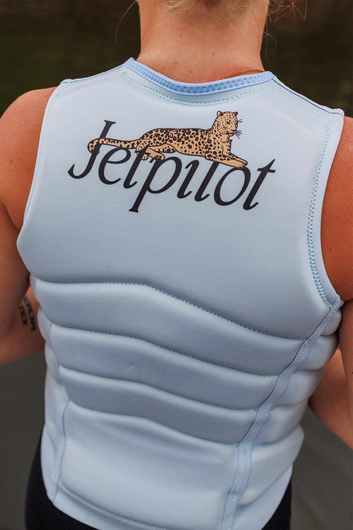 Back view of a model wearing the Ice Blue Zahra X1, showing the leopard on the Jetpilot script
